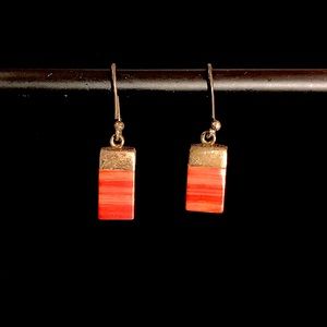 Orange and red striped rectangular earrings.